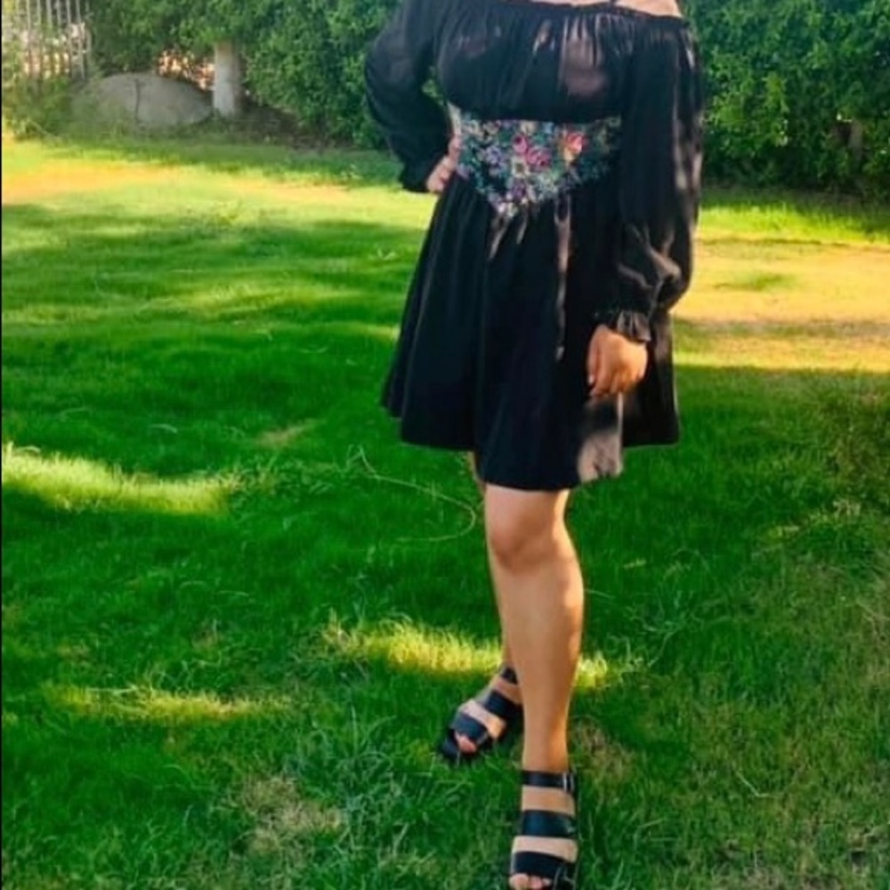 black dress with something in the center type corset